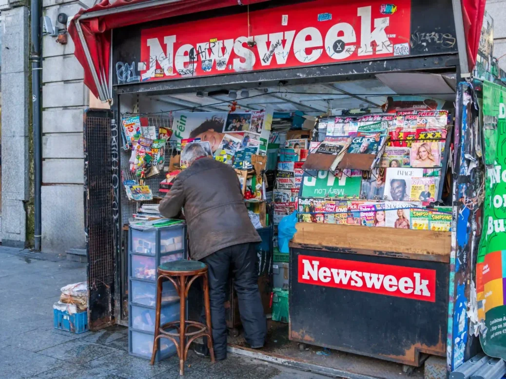 Old newspaper stand with the Newsweek sign in front of a house wall in Dublin, Ireland 2023. Picture: Shuttersock